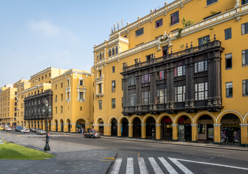 Colonial Yellow Building with Balconies in downtown Lima city ne Colonial building with wooden balconies in Lima's Historic Center, seen on a stopover tour