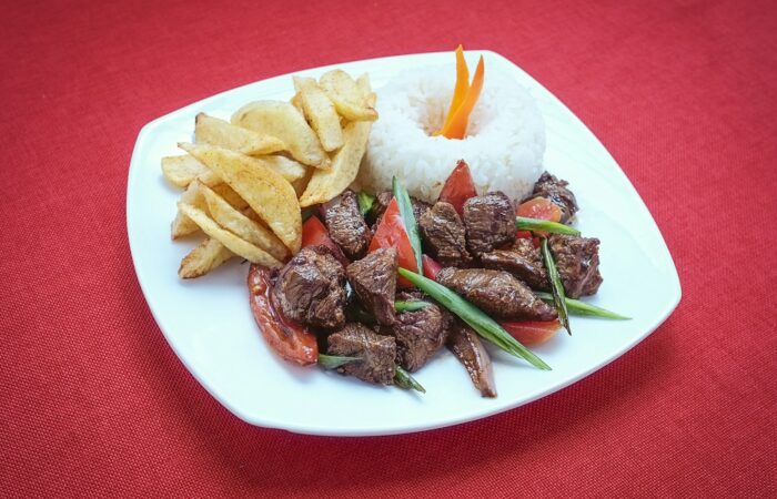 Lomo Saltado – Peruu2019s Ultimate Fusion Dish Lomo Saltado, Peruvian beef stir-fry with fries and rice, Cusco